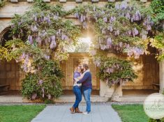 best engagement photographer near rochester ny, this couple posed for a sunset engagement session at George Eastman House in downtown Rochester with the wisteria.