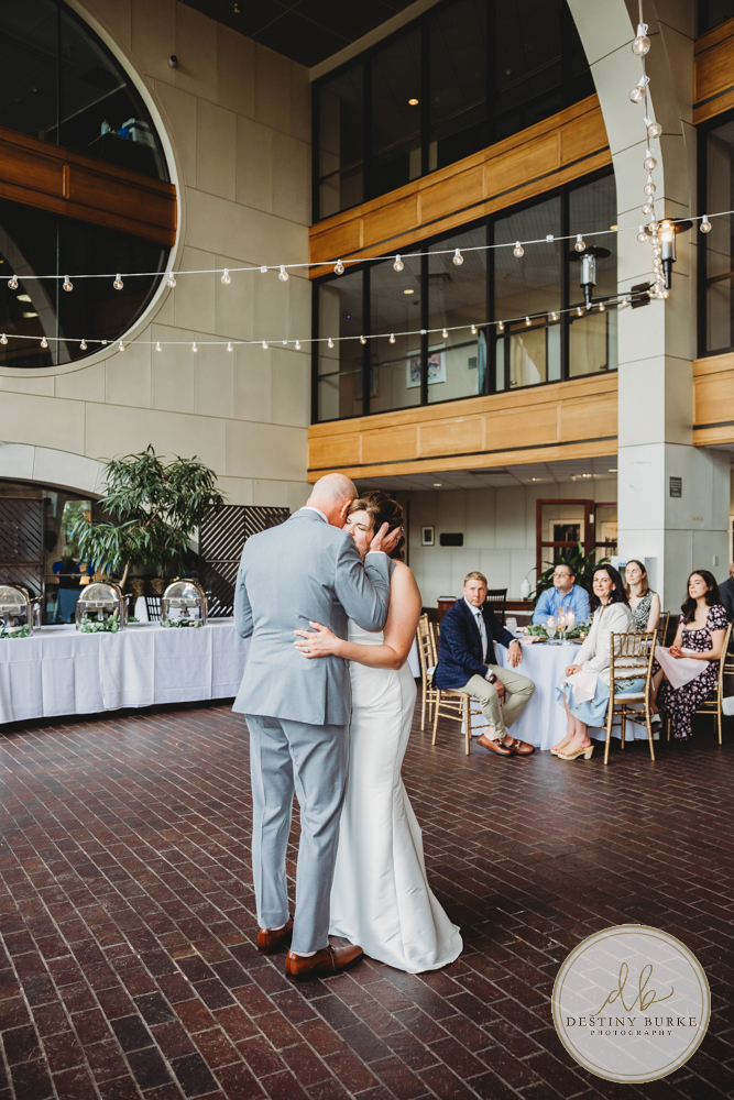 best wedding photography near Rochester, NY at Max of Eastman Place in downtown Rochester, wedding portraits, Kim Titus Hairstylist, Get Caked Bakery, Kittleberger Florist & Gifts.