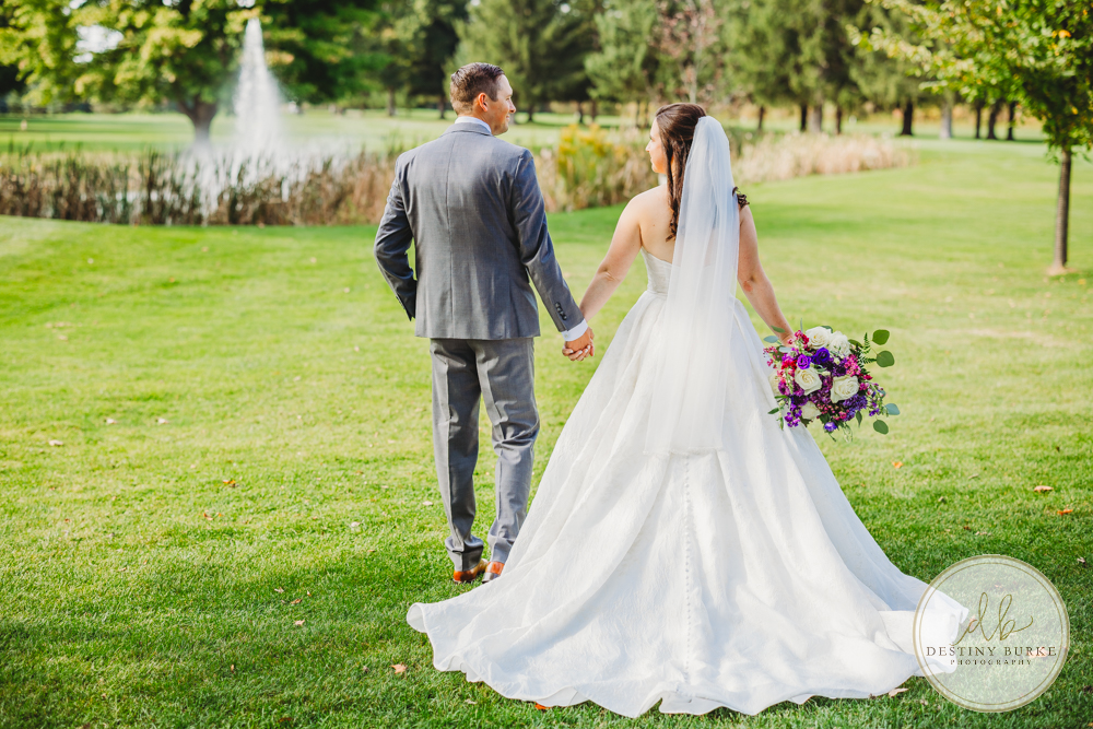 Couple's wedding day portraits from the best wedding photographer near Rochester, Brockport, NY Golf Course Venue Deerfield Country Club, purple themed marriage.