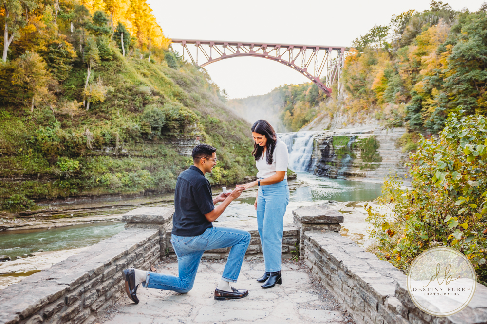best surprise proposal engagement photographer near rochester ny letchworth state park castile ny upper middle falls Waterfall engagement session