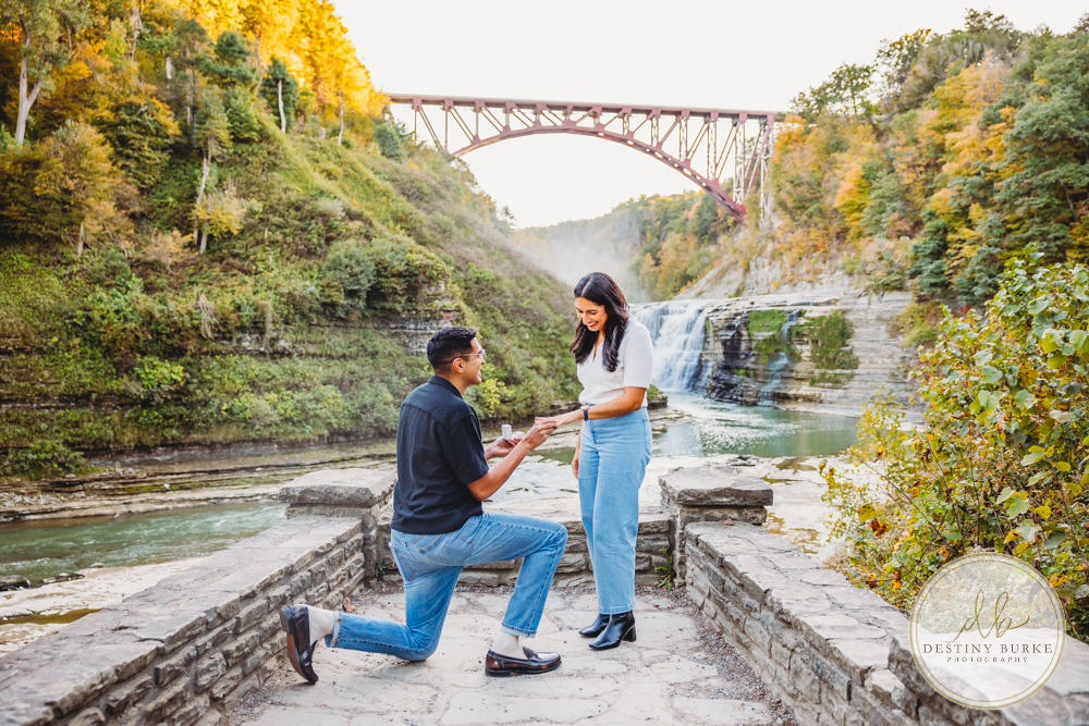 best surprise proposal engagement photographer near rochester ny letchworth state park castile ny upper middle falls Waterfall engagement session