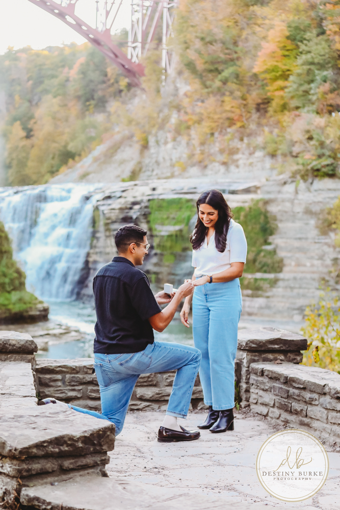 best surprise proposal engagement photographer near rochester ny letchworth state park castile ny upper middle falls Waterfall engagement session