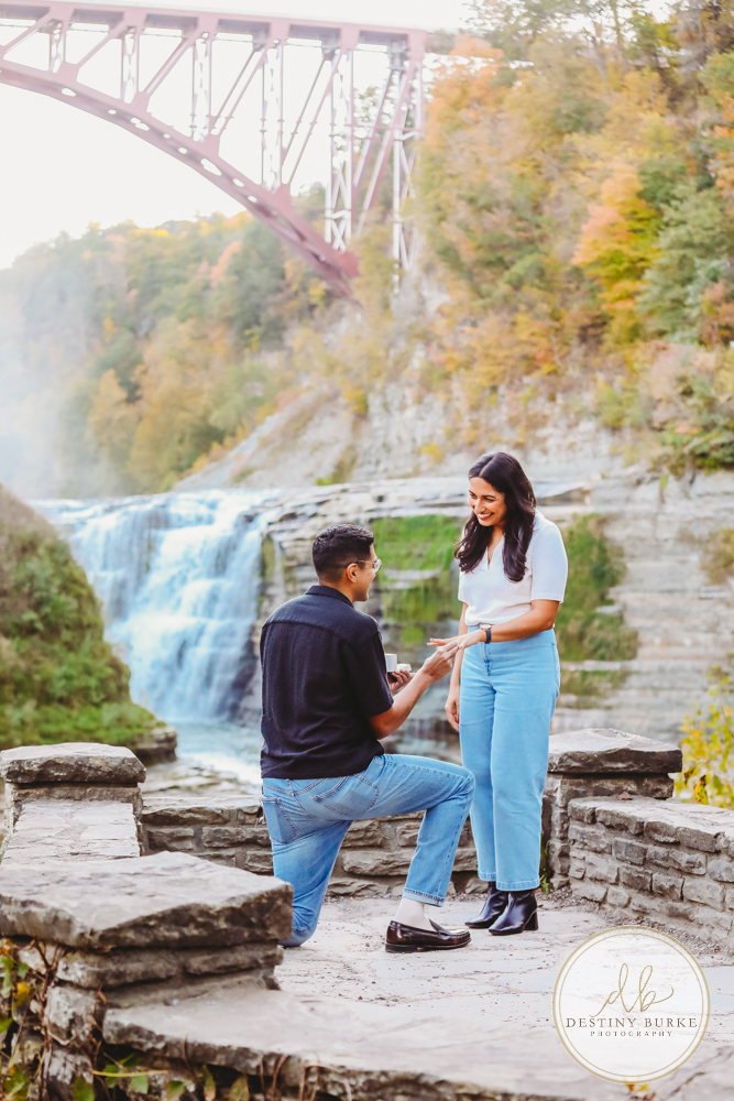 best surprise proposal engagement photographer near rochester ny letchworth state park castile ny upper middle falls Waterfall engagement session