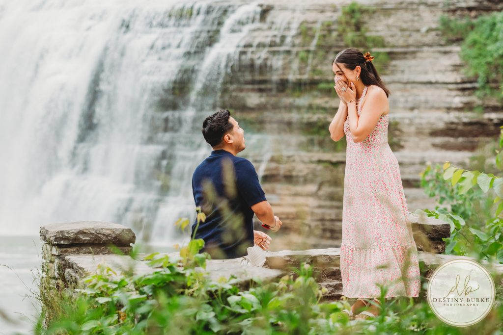 Summer surprise proposal at Letchworth State Park near Rochester, NY, captured by one of the best surprise proposal photographers, featuring golden light, scenic overlooks, and an emotional engagement moment.