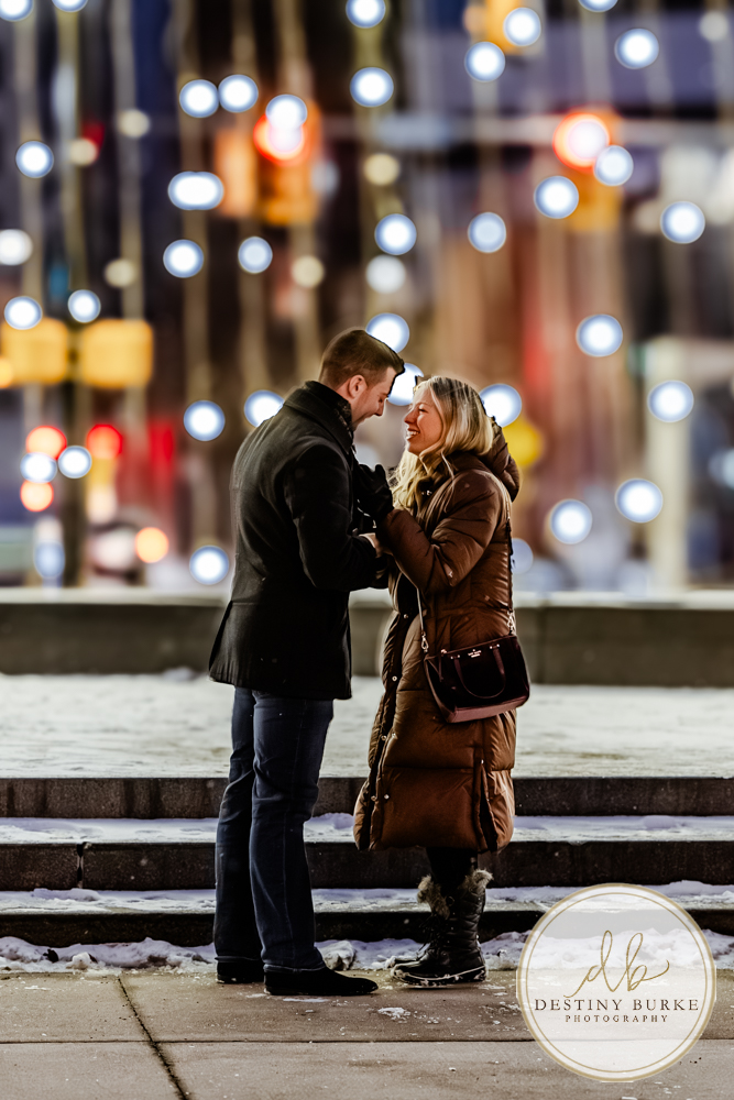 Premium proposal photography in Rochester, NY for couples seeking a high-end, personalized engagement experience in a beautiful winter city setting.