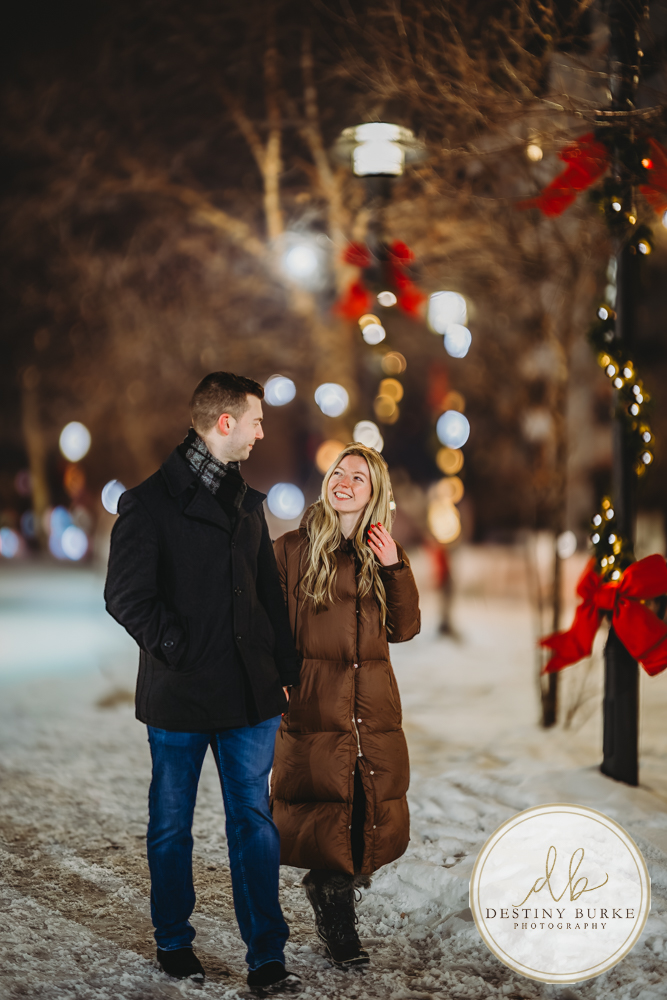 Romantic surprise proposal in Rochester, NY with refined winter city lights, capturing a once-in-a-lifetime moment for a couple beginning their forever together.