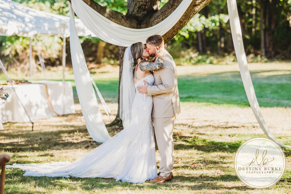 Outdoor wedding ceremony with family and friends in Rochester NY backyard sunset portraits