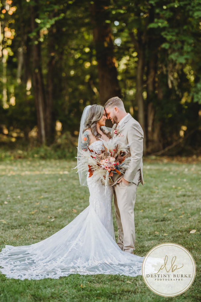 Outdoor wedding ceremony with family and friends in Rochester NY backyard sunset portraits