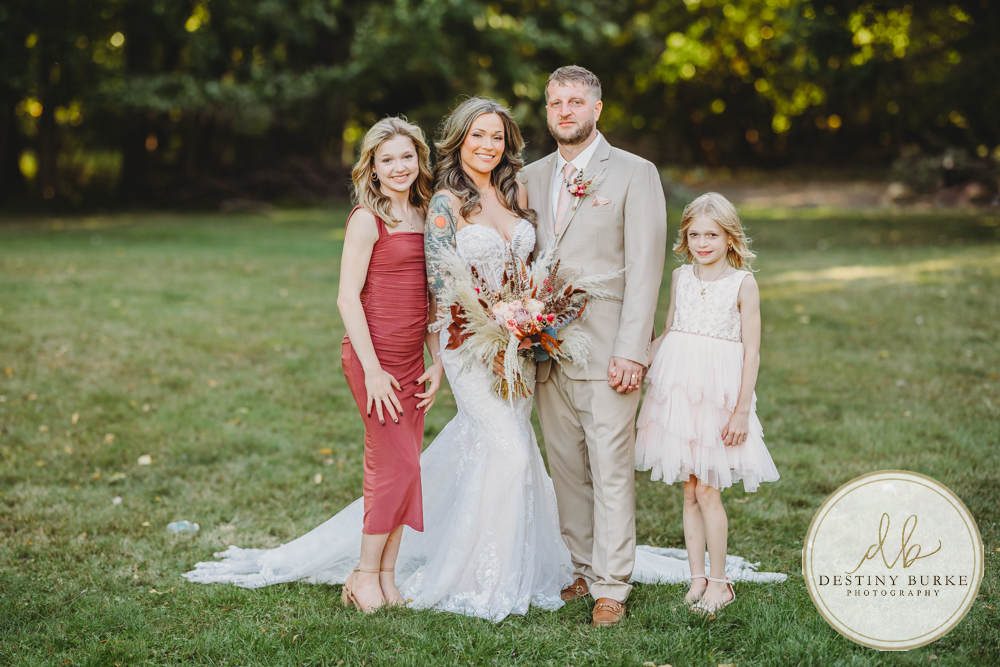 Outdoor wedding ceremony with family and friends in Rochester NY backyard sunset portraits