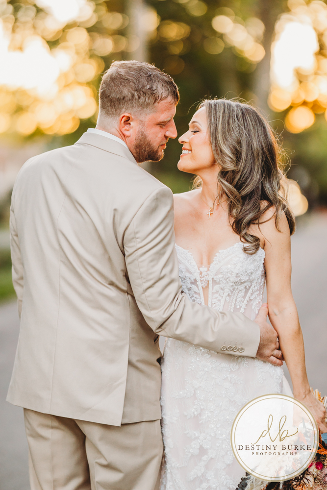 Outdoor wedding ceremony with family and friends in Rochester NY backyard sunset portraits
