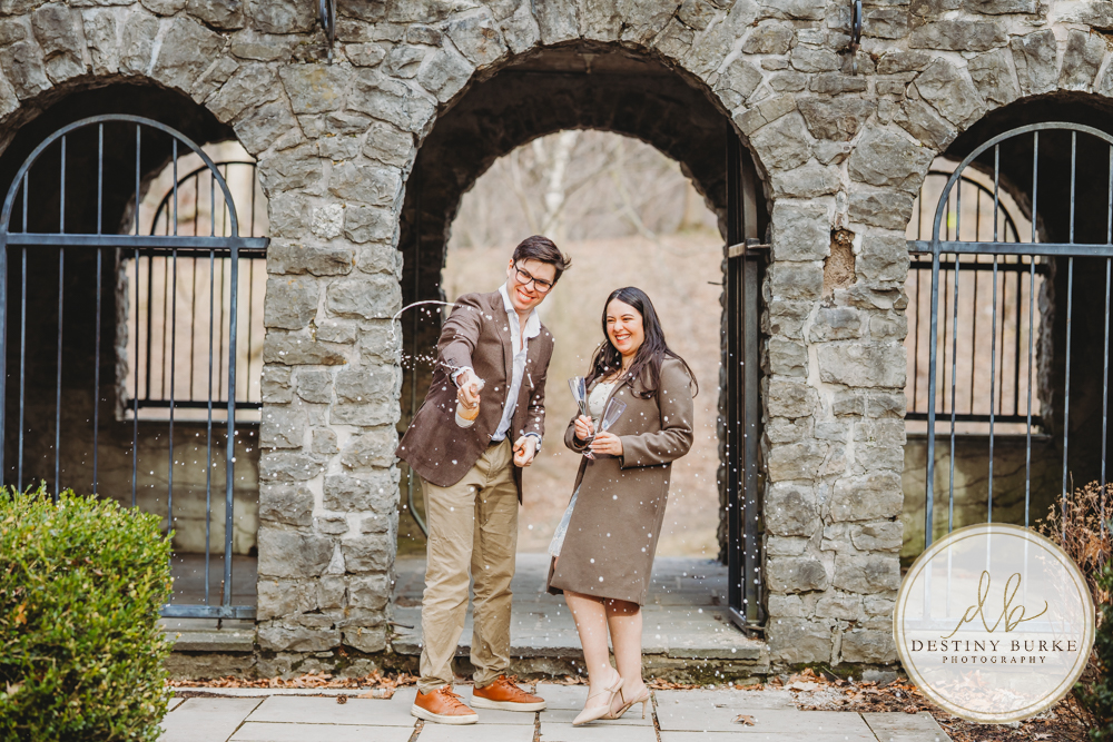 Engagement photos at Sunken Gardens Rochester NY golden hour romantic portraits Proposal photographer capturing candid engagement moment in Rochester NY