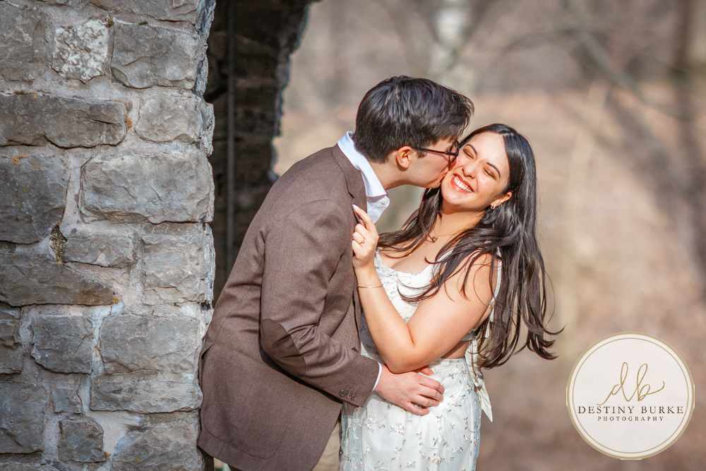 Engagement photos at Sunken Gardens Rochester NY golden hour romantic portraits Proposal photographer capturing candid engagement moment in Rochester NY