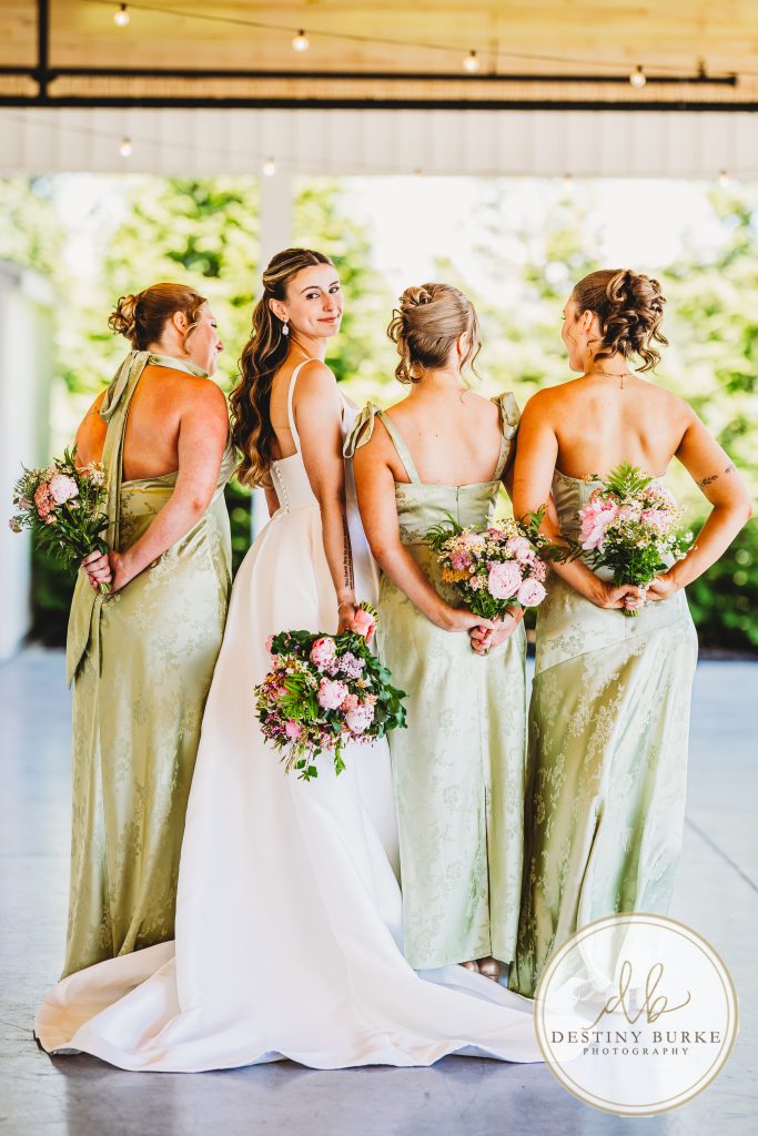 Bridesmaids and bride getting ready in the bridal suite at Pomona at Blue Barn wedding venue in Hilton NY